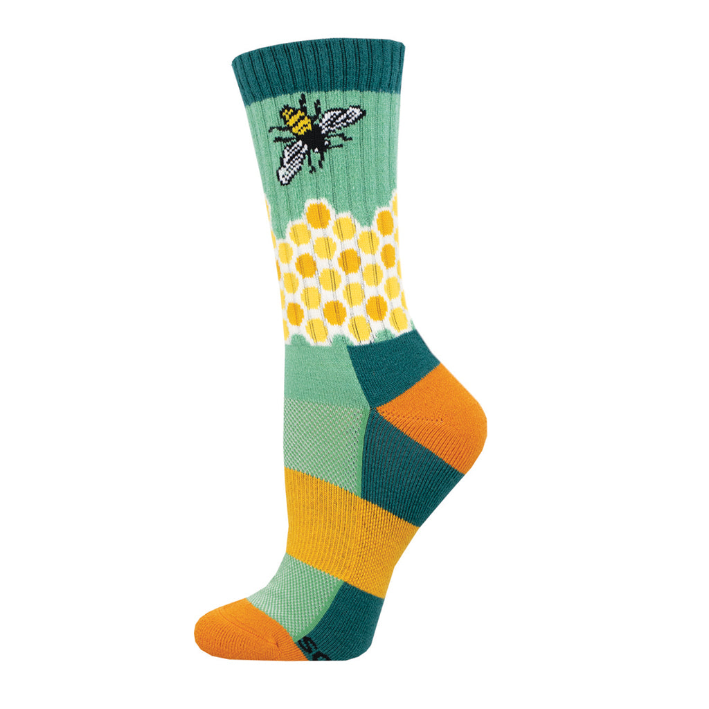 A colorful pair of Merino wool socks with a geometric pattern featuring a honeycomb design and a bee motif.