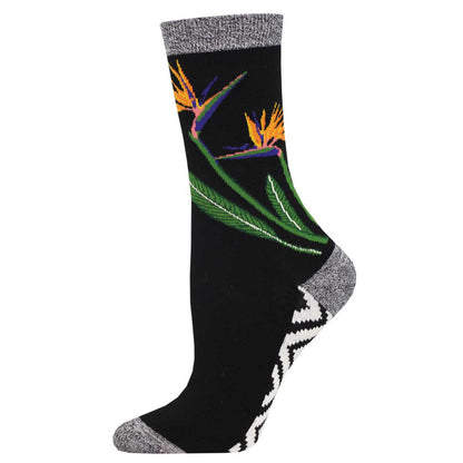 A pair of women's socks with a floral pattern featuring birds of paradise flowers on a black background.