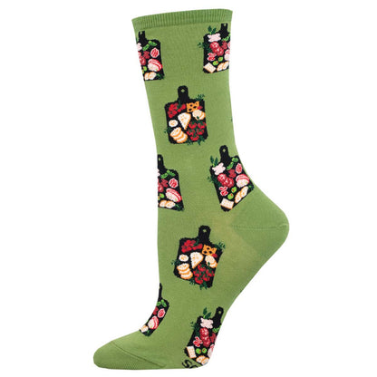 A pair of green crew socks with a pattern of various food items like meat, cheese, and crackers.
