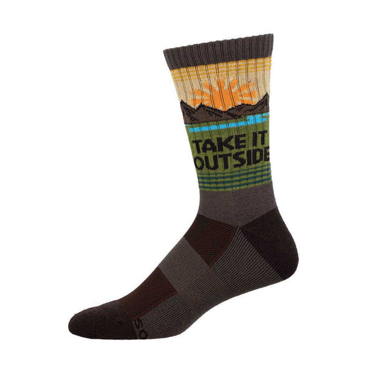A pair of Merino wool socks with a mountain and sunset design, featuring text that reads 'TAKE IT OUTSIDE'.